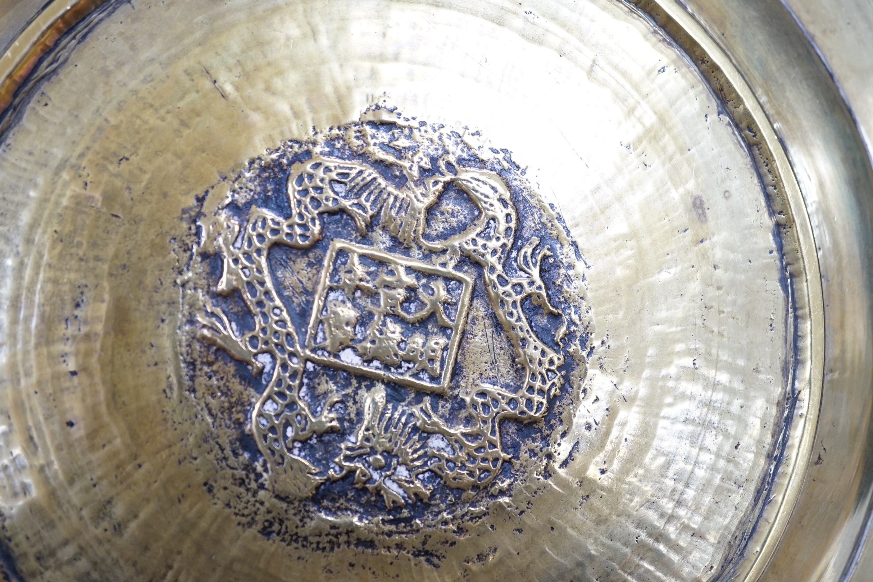 A Chinese engraved brass plate, large engraved beaker, koi fish and a dragon, the largest 24cm in diameter